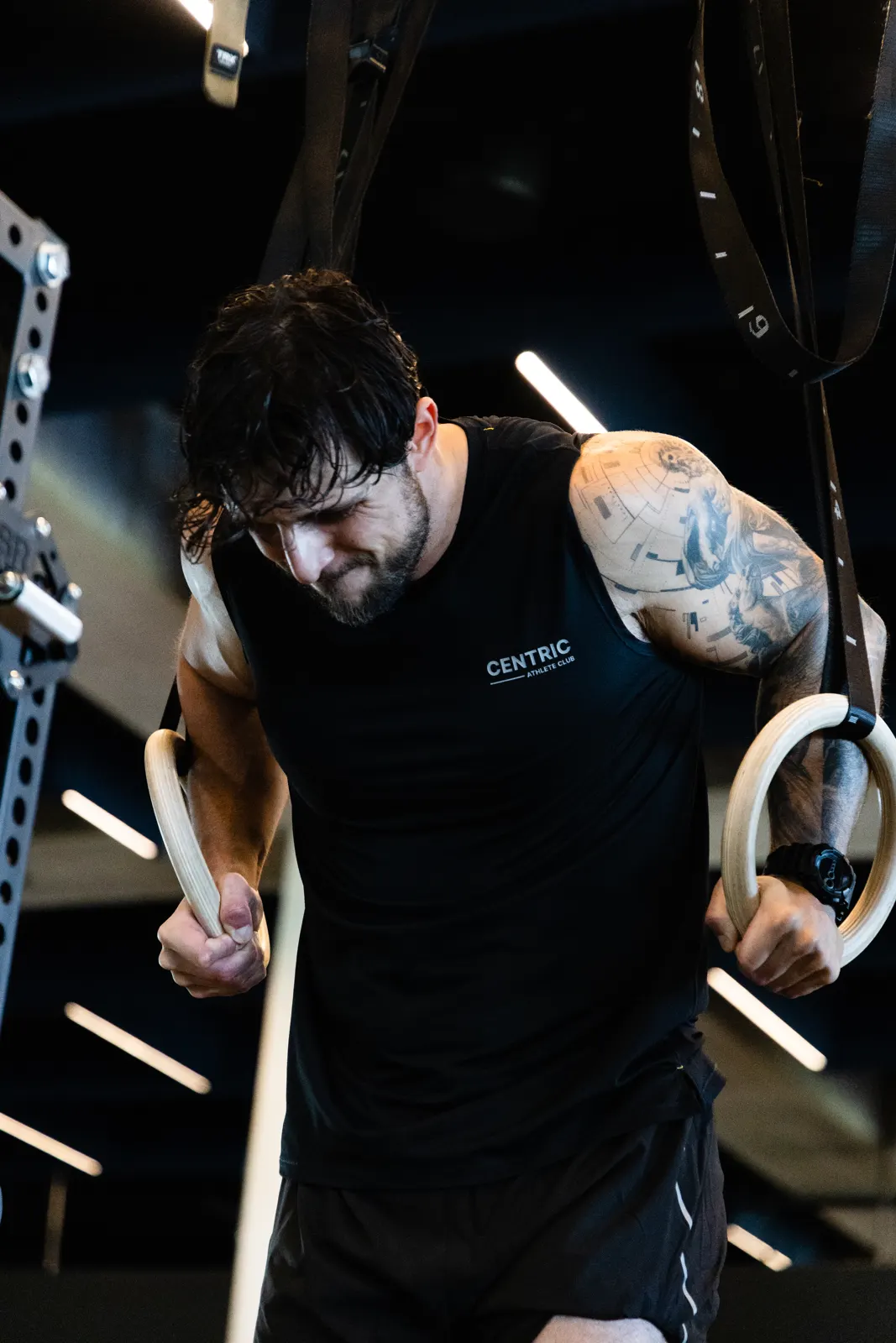 Athlete on gymnastics rings in a Centric tank